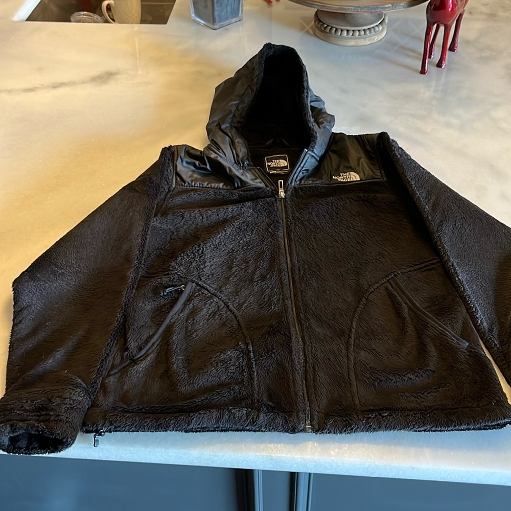 Women’s black north face hooded teddy jacket, size medium.